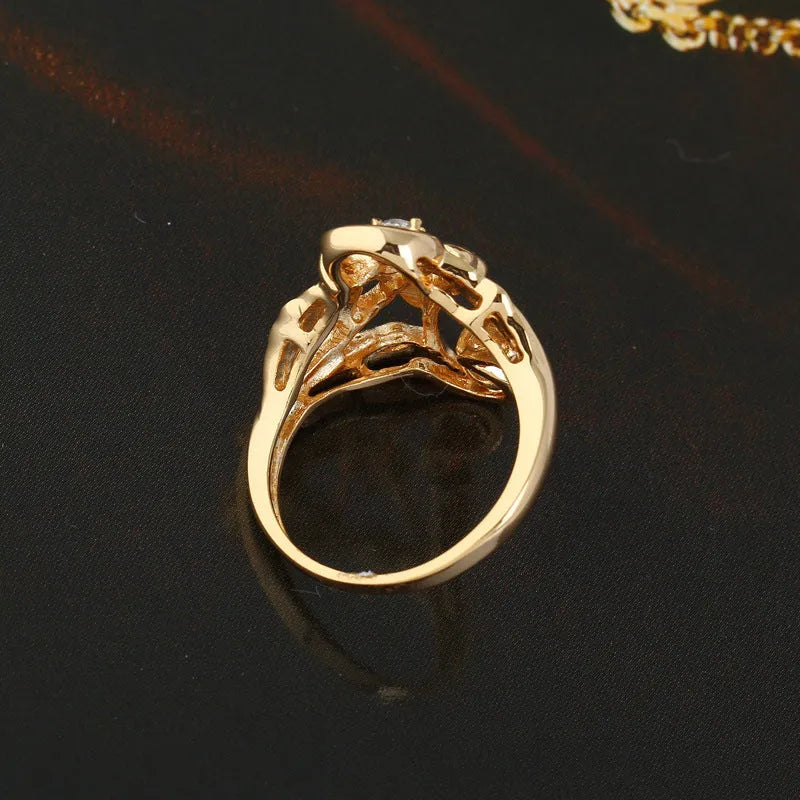 Gold tone copper ring with exaggerated irregular leaf design and white zircon stones, women's geometric band ring