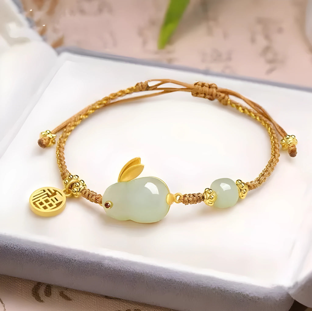 Hetian jade rabbit charm bracelet on yellow string with geometric shape