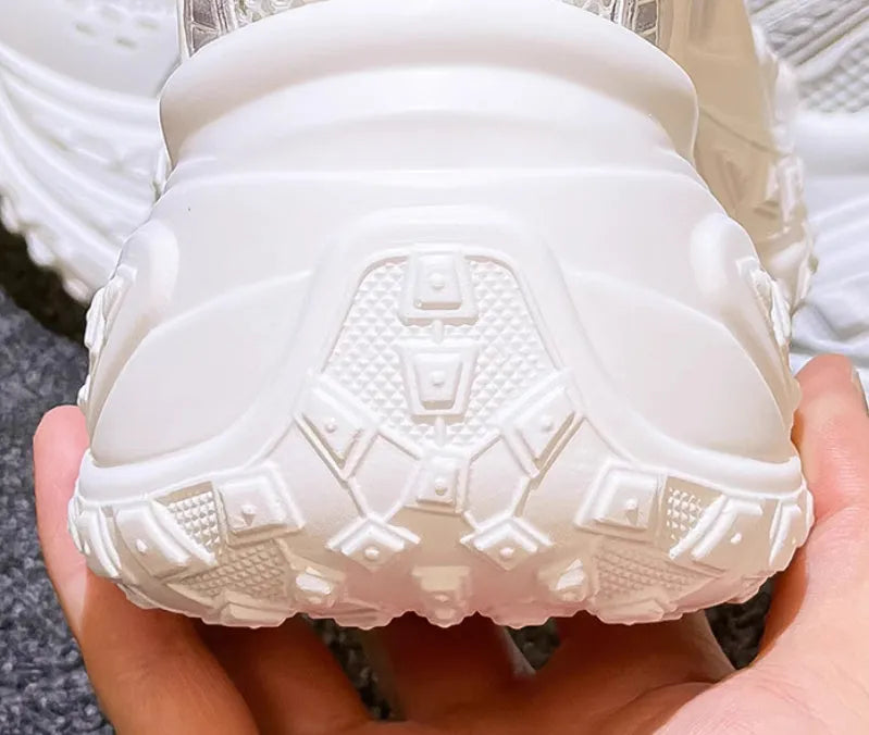 White women's dad shoes with lace-up closure showing round toe design and height increasing insole construction