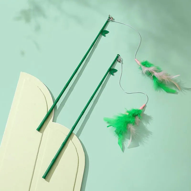 Green interactive cat feather wand toy with bell and feather attachments