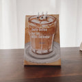 Coffee-themed mini desk calendar for 2025 with motivational designs for compact organisation