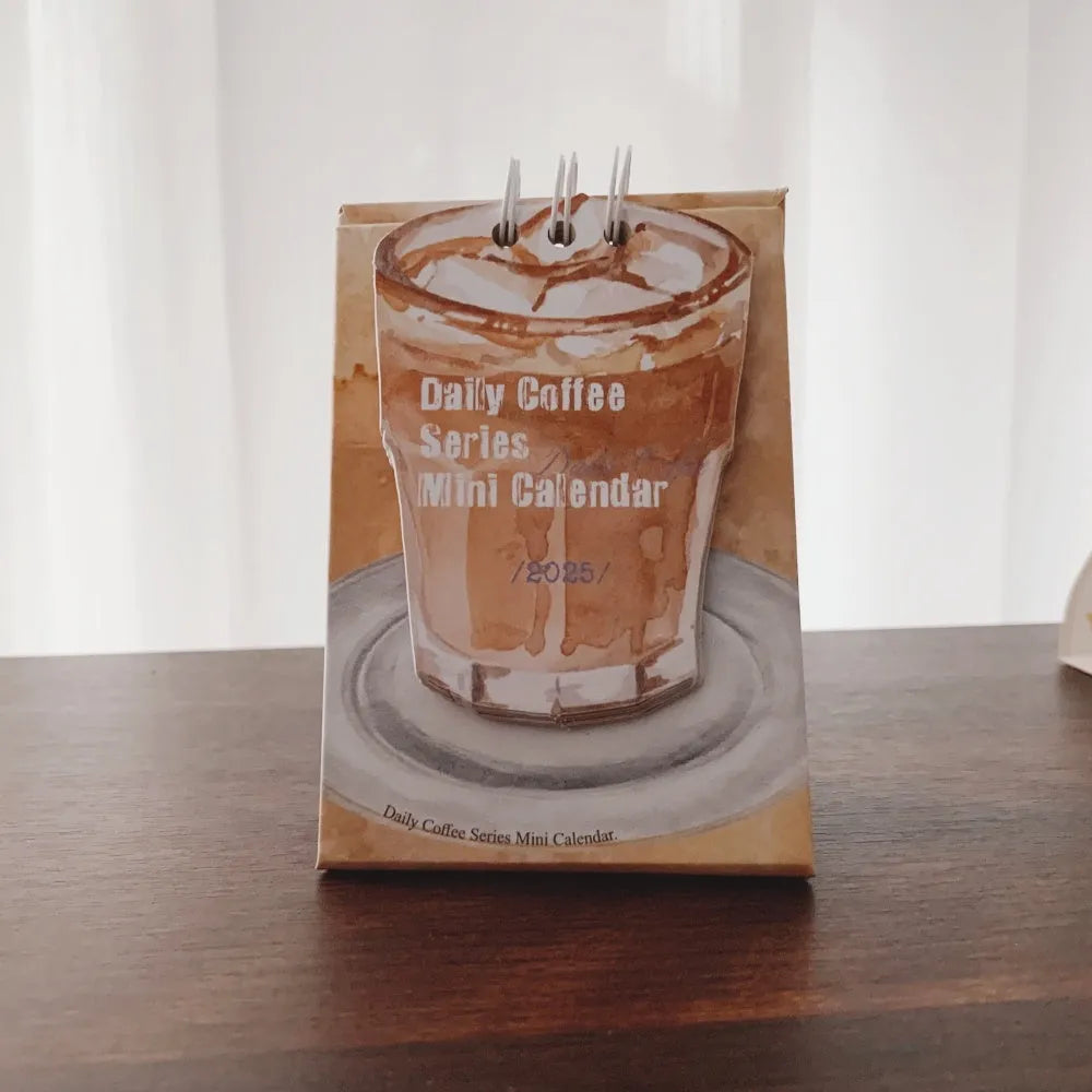 Coffee-themed mini desk calendar for 2025 with motivational designs for compact organisation