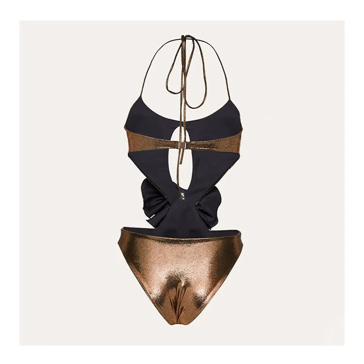 Gold coloured handmade one-piece swimsuit with halter neckline and hollow-out design on a mannequin.