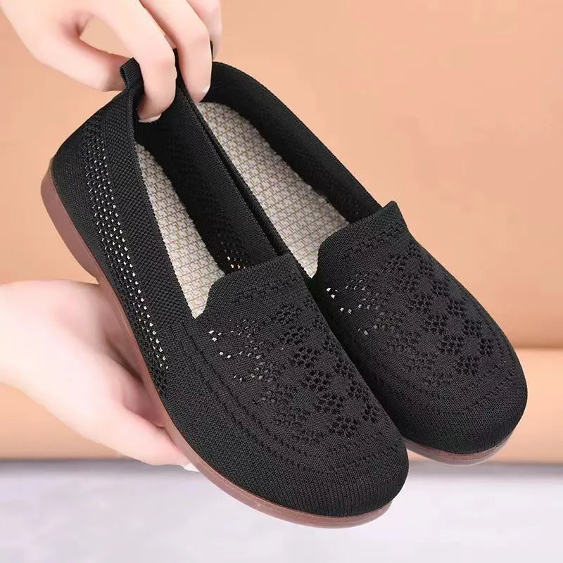 Beige women's low-top casual trainers with breathable Flyknit mesh and a flat antiskid PVC sole.