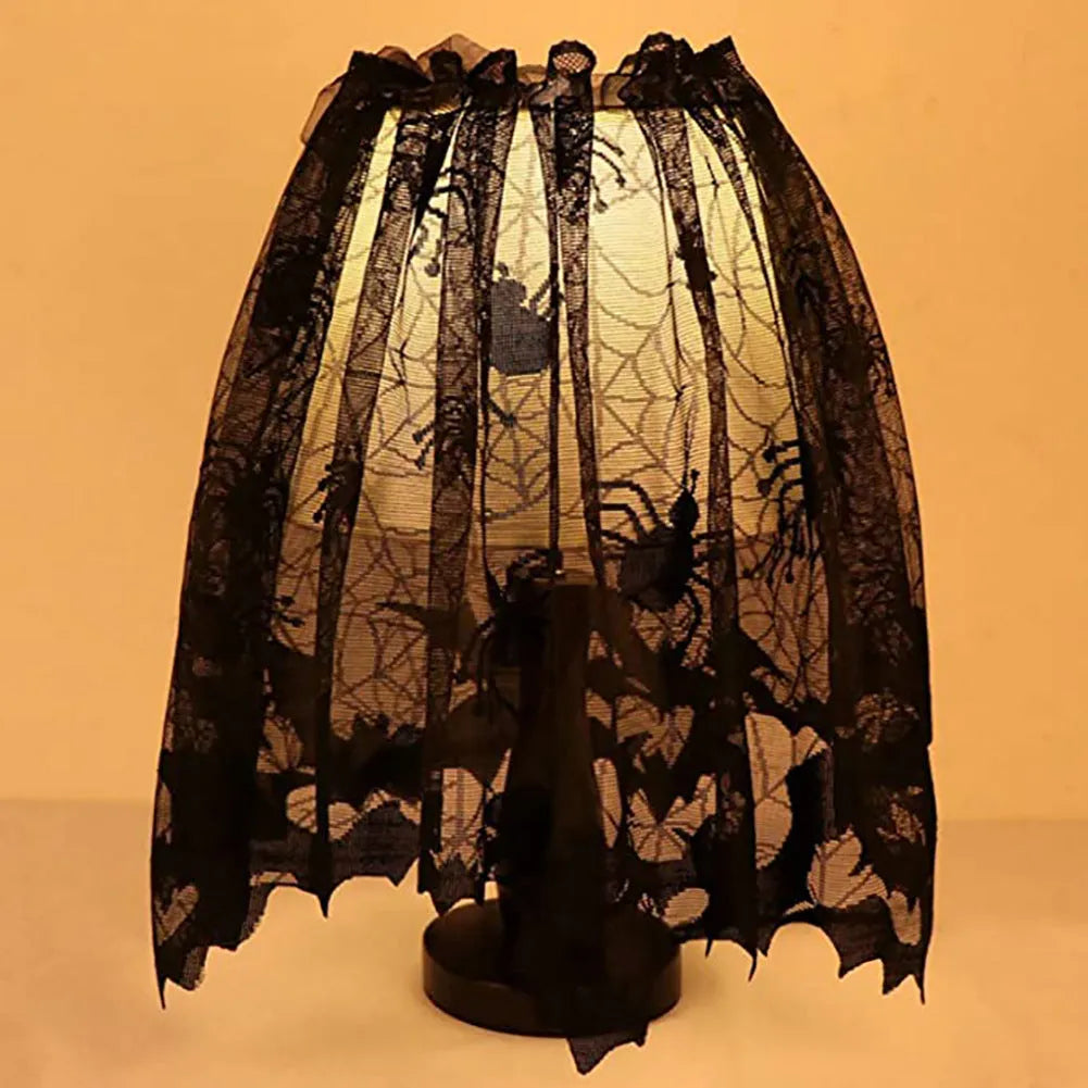 Black lace spider mesh Halloween tablecloth, rectangular 50 x 152cm polyester, with ribbon.