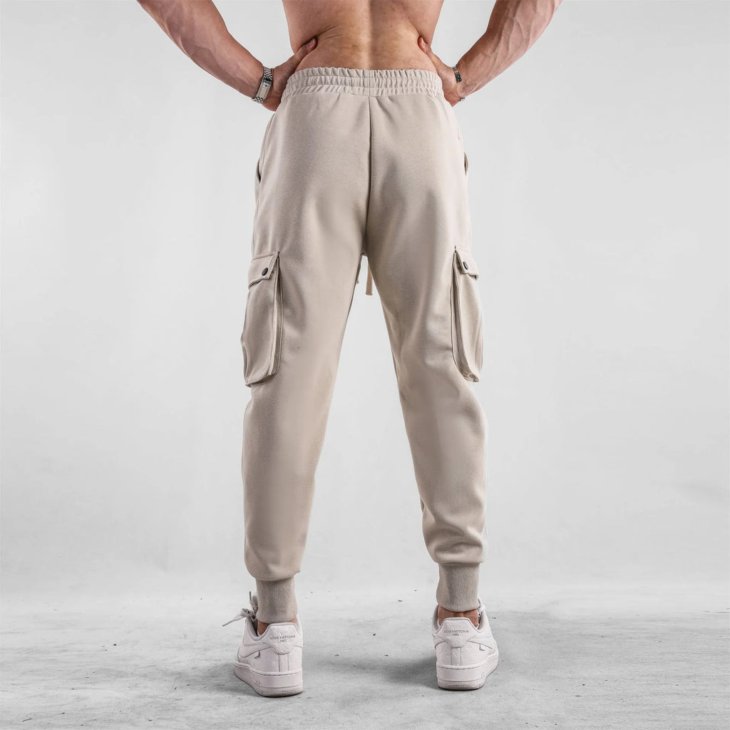 Men's loose cotton sports trousers with ankle ties and multiple pockets in various colours