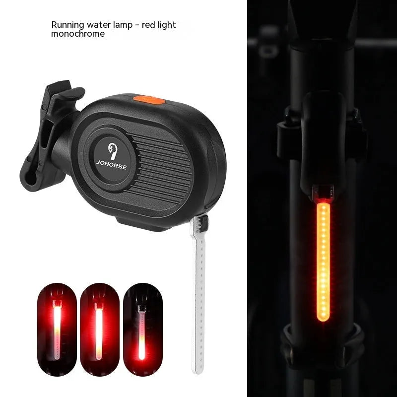 Blue waterfall effect bicycle tail light mounted on a bike seat post, showing dynamic LED light pattern.