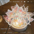 Butterfly night lamp with glass shade on raw wood base for bedroom ambience lighting