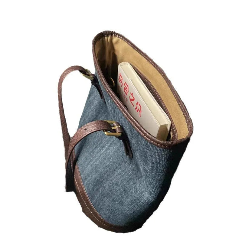 Denim patchwork polyester bucket handbag showing structured shape and one-shoulder strap
