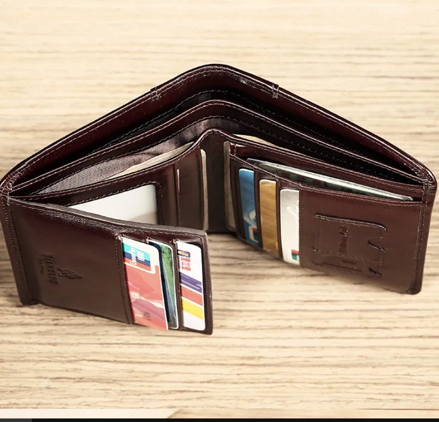 Men's black leather wallet showing multiple card slots, coin pocket, and document section