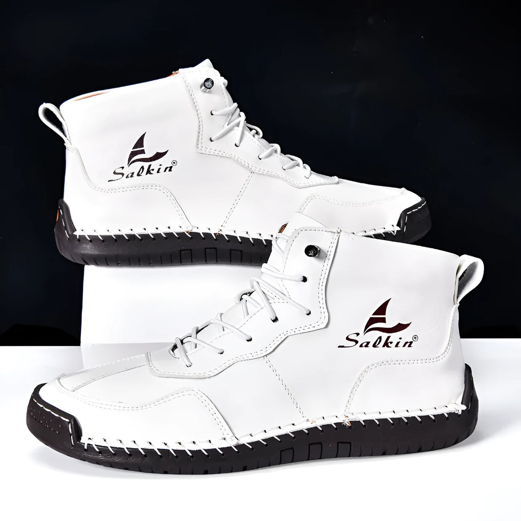 Men's beige retro-style mid-calf boots with an elastic band and flat rubber sole on a white background.