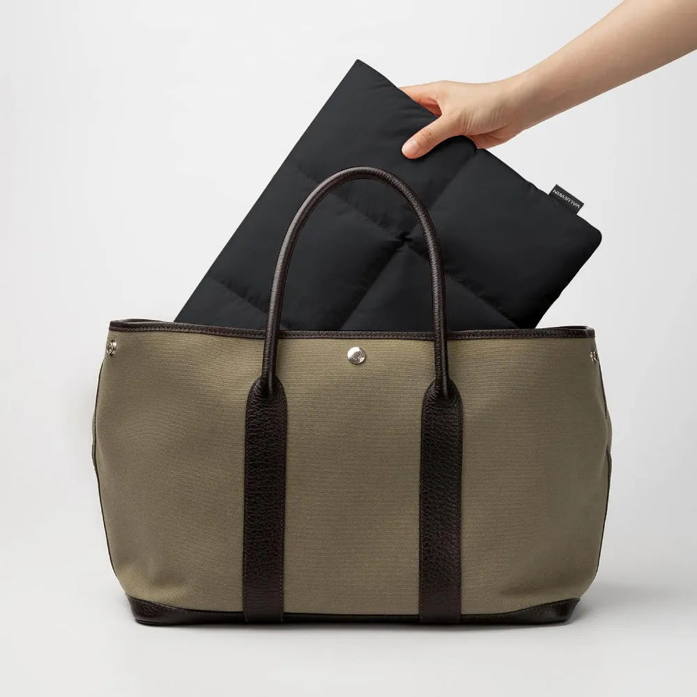 Soft fluffy polyester laptop sleeve in black with retro sewing thread detailing for 13-15.6 inch devices