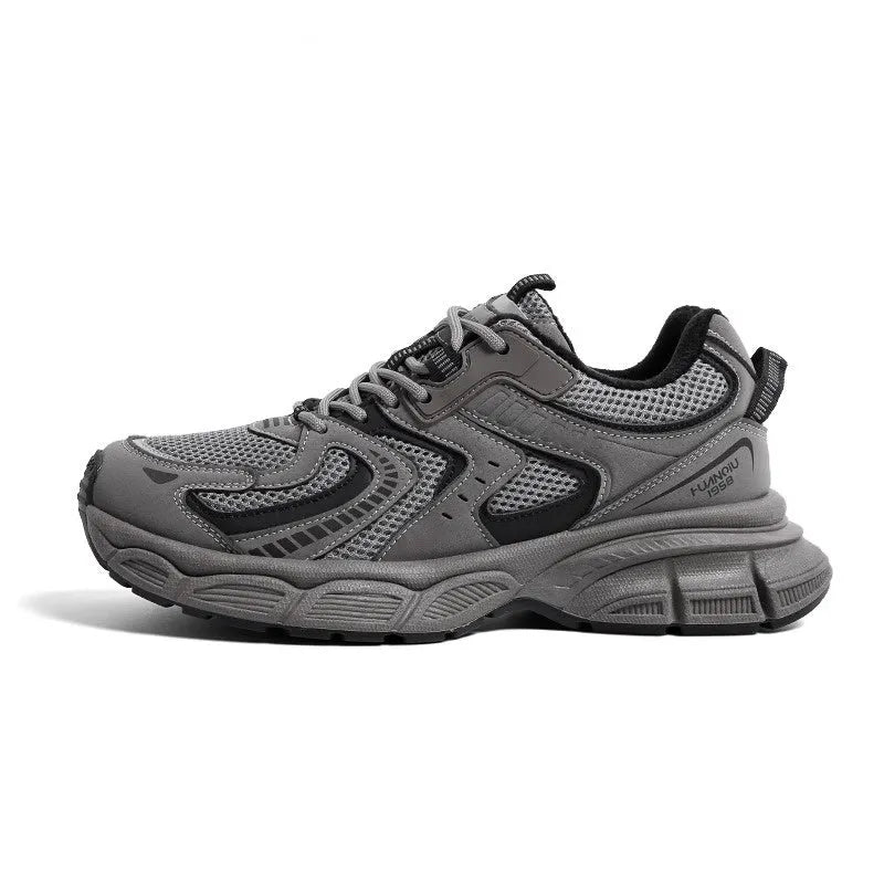 Men's grey low-top platform sneakers with leather stitching on a PU mesh upper and a flat EVA sole.