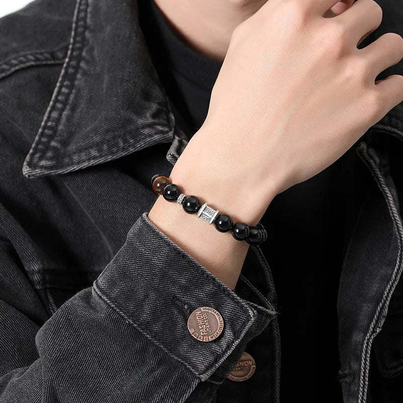 Men's obsidian prayer wheel bracelet with 10mm beads and hand-woven silver elements