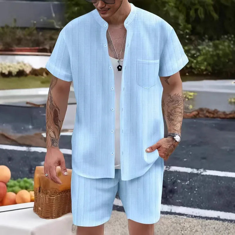 Men's Henry collar short sleeve shirt and shorts set in apricot placed on flat surface