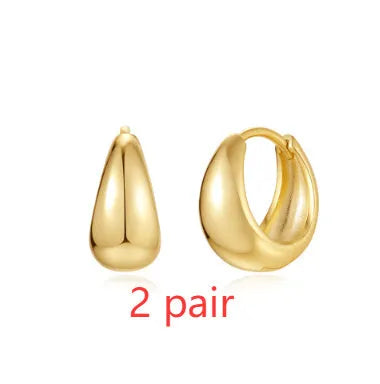 Brass diamond earclip earrings with electroplated gold finish and geometric round design