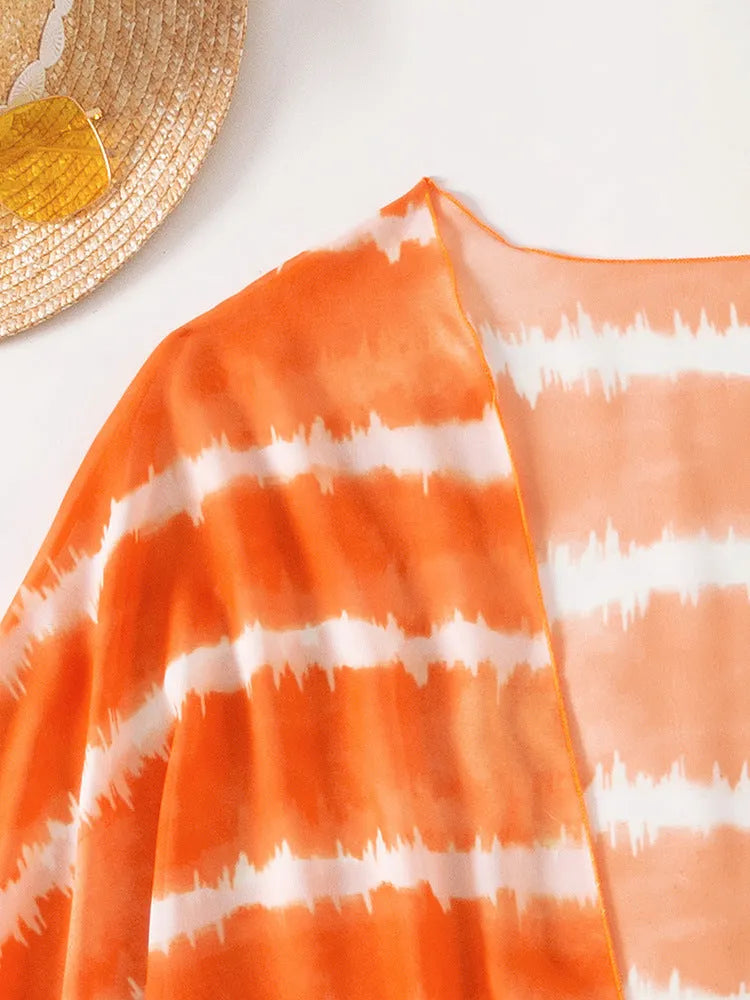 Women's orange three piece swimsuit with nylon colour blocking fabric, bra, panties and cardigan.