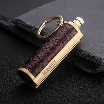 Windproof leather lighter with personality metal sticker in red, black, reddish-brown or yellow leather.