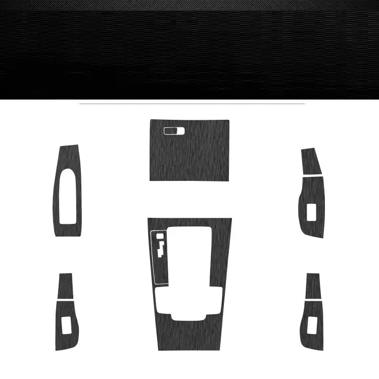 Car interior decorative film sticker kit showing pre-cut pieces for centre console and trim modification