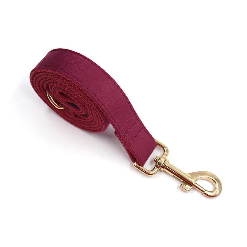 Soft burgundy velvet dog collar with gold metal clasp, available in XS to XL with optional engraving