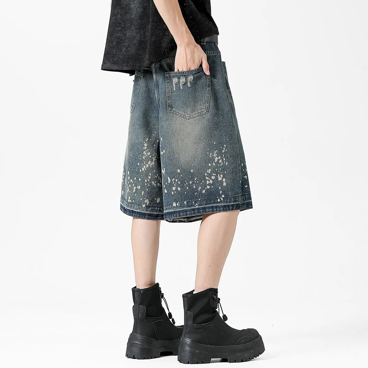 Men's retro blue denim shorts with ripped details and splash ink pattern