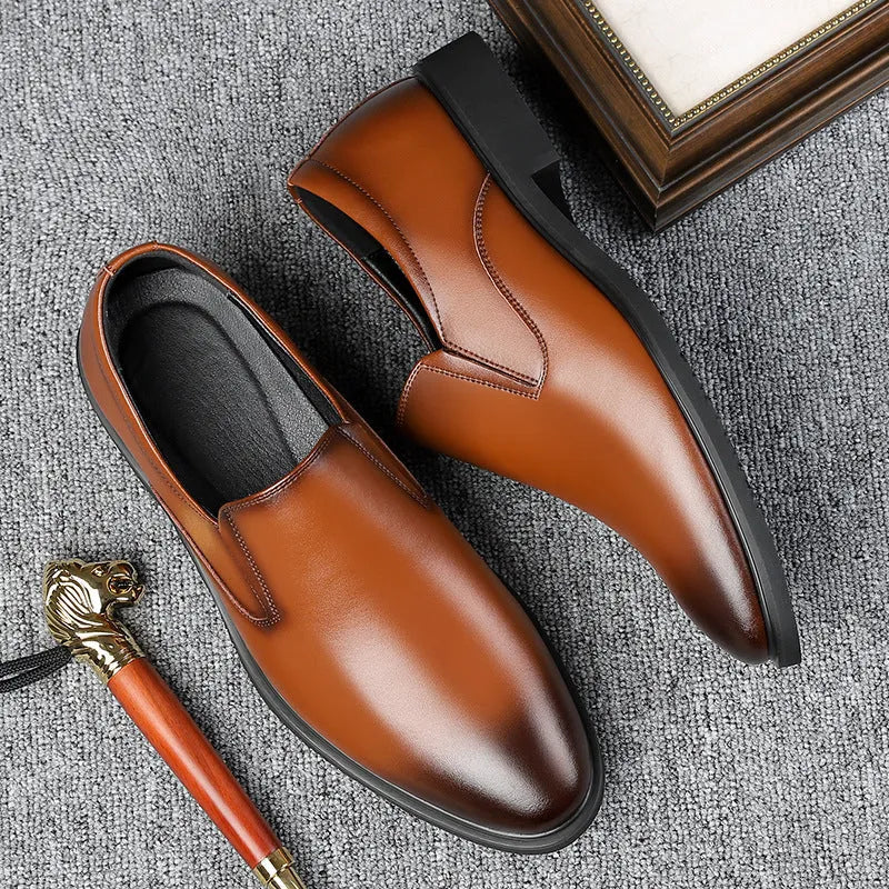 Men's black leather business casual slip-on shoes with rubber sole and sewing line detail.