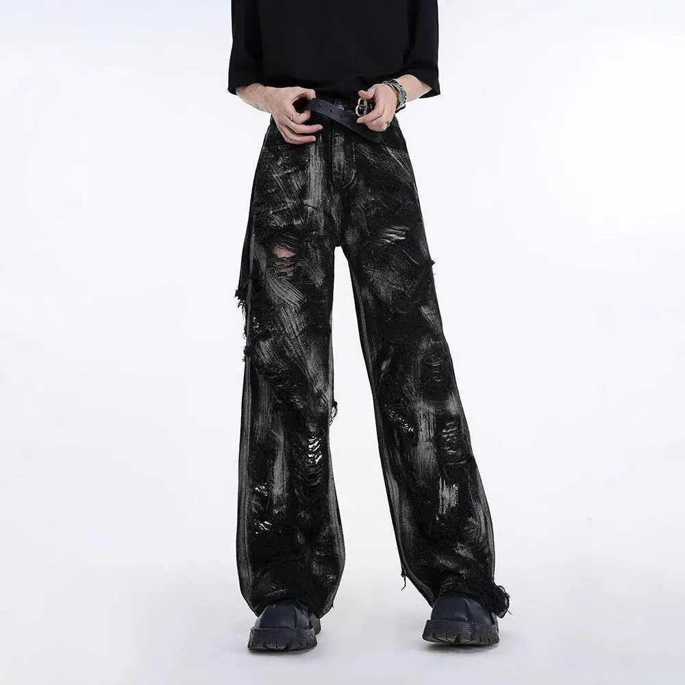 American high street wasteland style men's denim jeans with graffiti detailing and heavyweight washed fabric