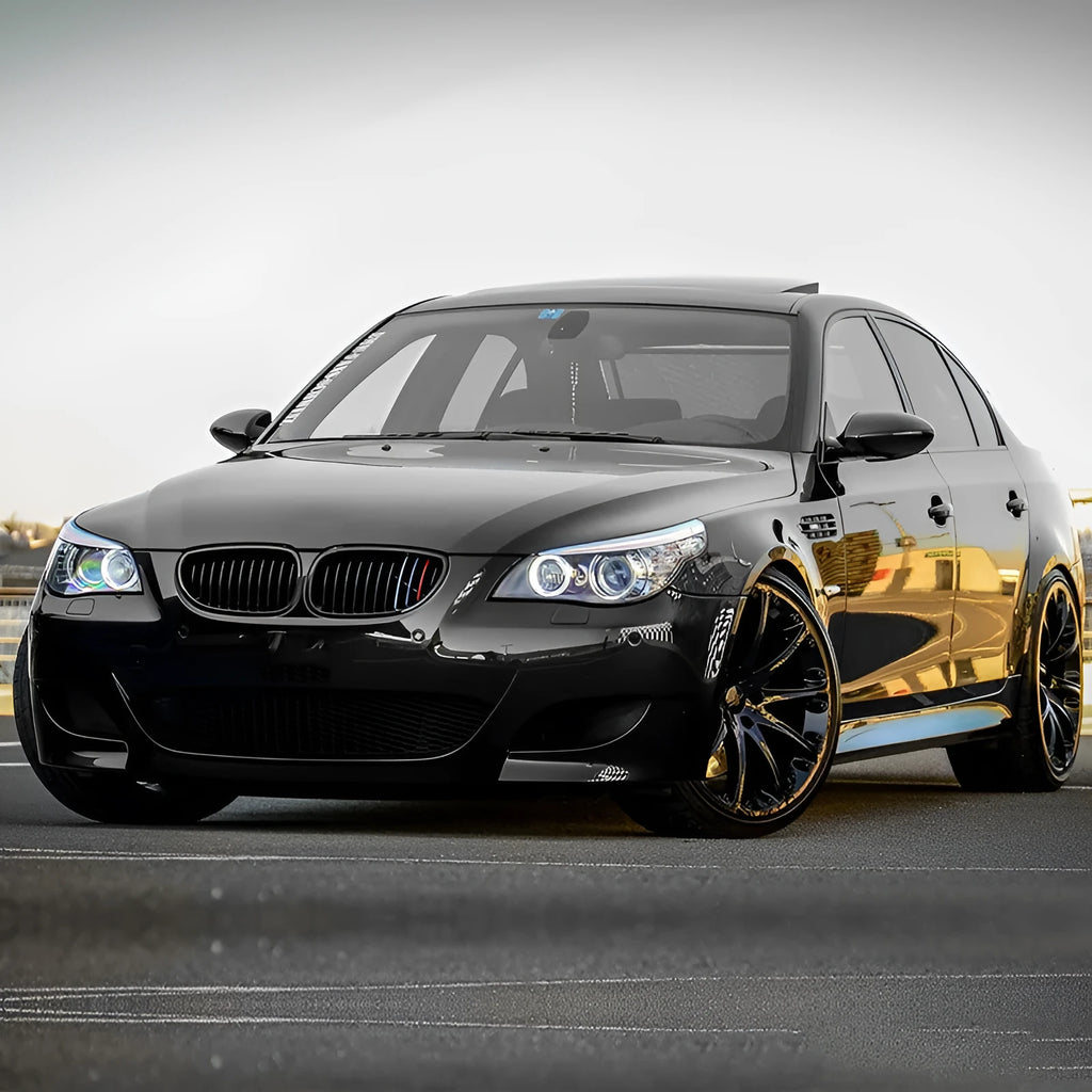 Pair of ABS carbon fibre pattern grilles for a BMW 5-Series front bumper.