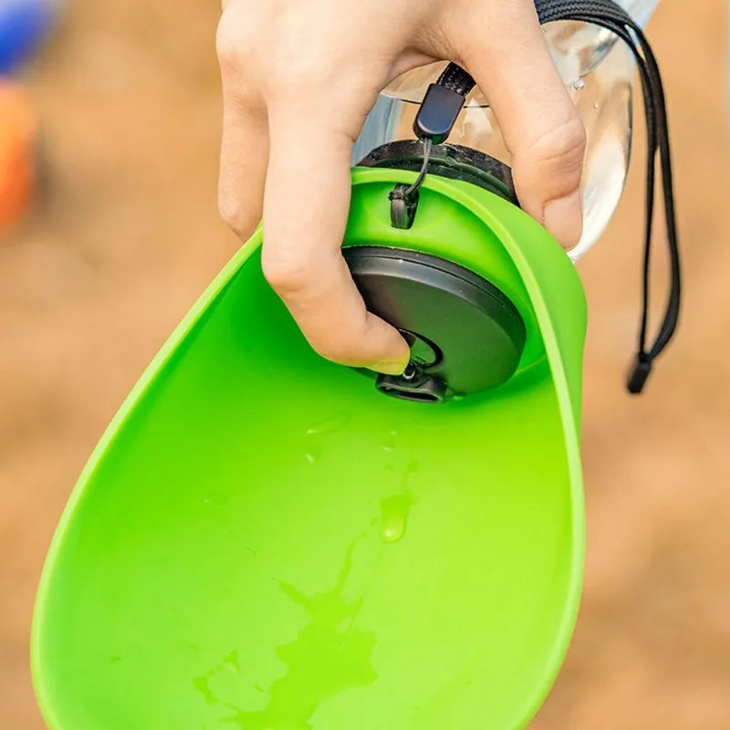 Portable blue dog water bottle with drinking bowl showing 680ml capacity and leak-proof design