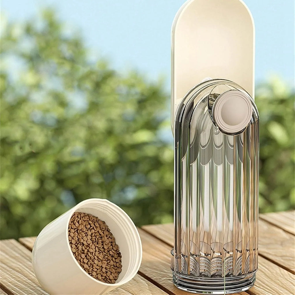 Beige foldable dog water bottle with food dispenser shown next to a dog on a walk