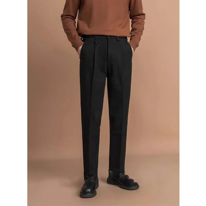 Man wearing straight-fit suit pants in a draped silhouette, suitable for business and casual occasions.