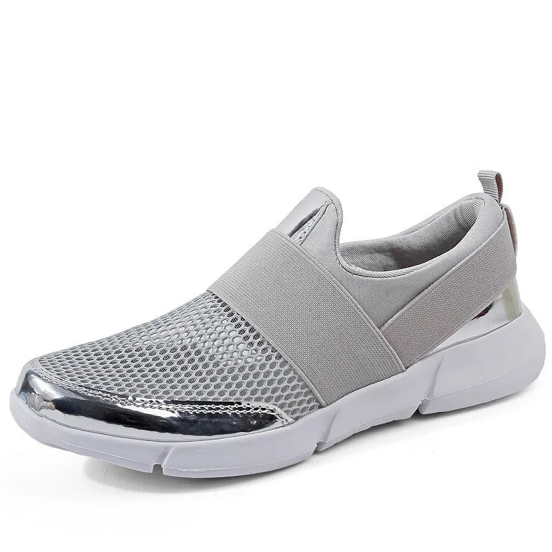 Women's low-top casual sneaker in grey with breathable mesh upper and lightweight sole.