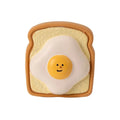 Yellow cartoon egg bread shaped latex dog chew toy with bite resistant design