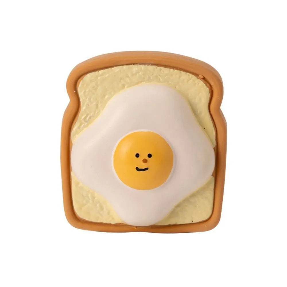 Yellow cartoon egg bread shaped latex dog chew toy with bite resistant design