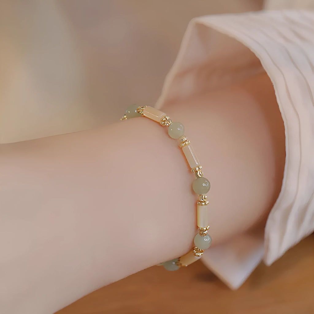 Hetian jade bamboo joint bracelet 6mm bead size on display against neutral background