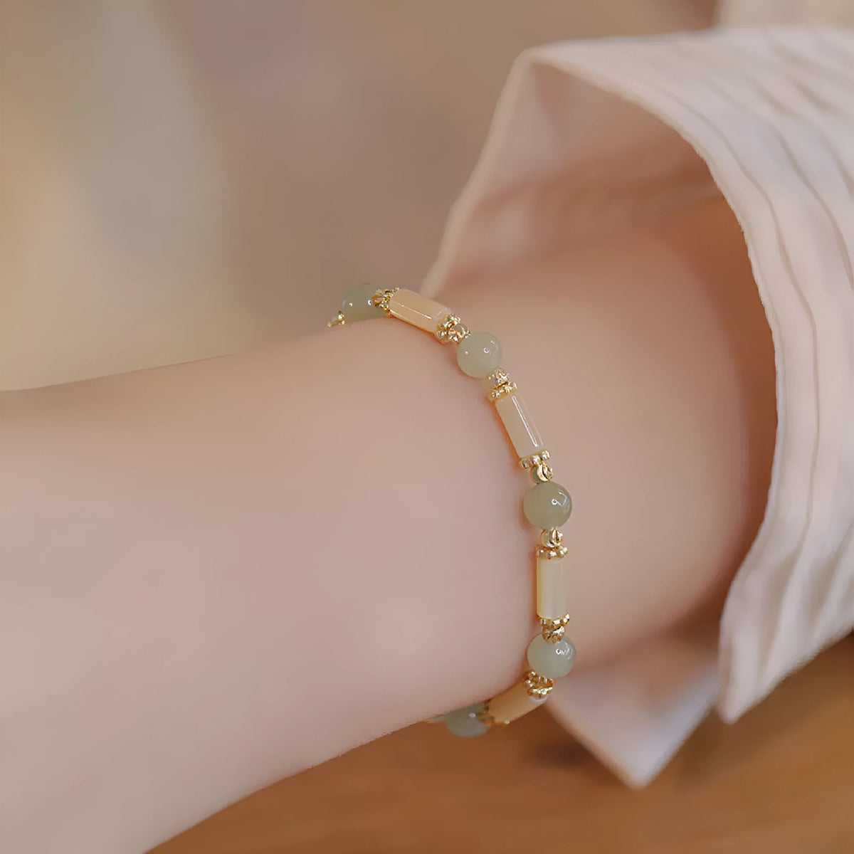 Hetian jade bamboo joint bracelet 6mm bead size on display against neutral background