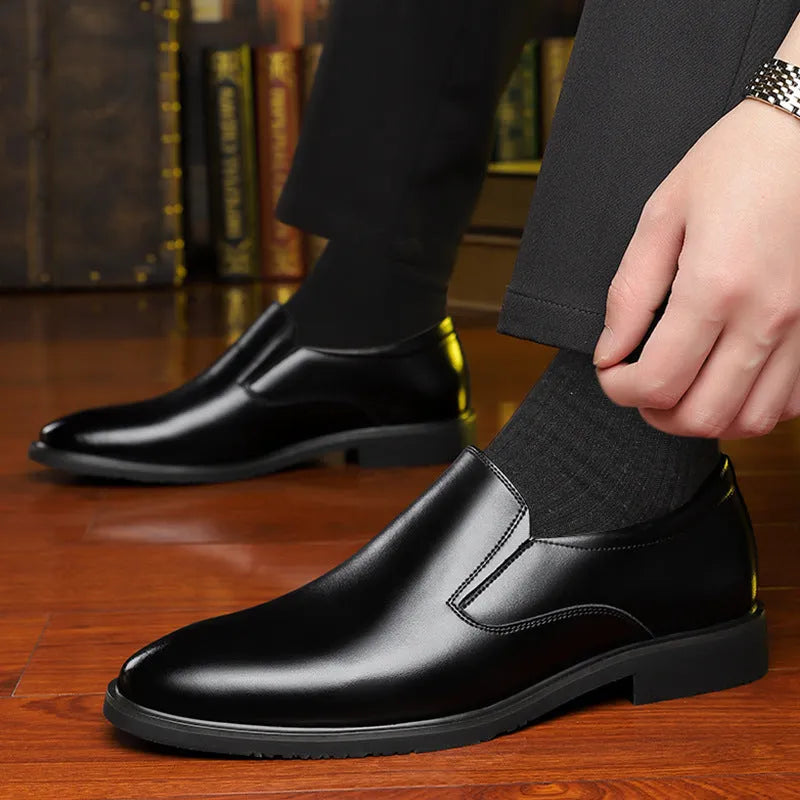 Men's black leather business casual slip-on shoes with rubber sole and sewing line detail.
