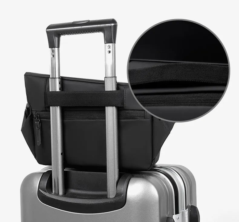 Grey men's medium crossbody bag with shoulder strap showing zipper opening and horizontal square shape