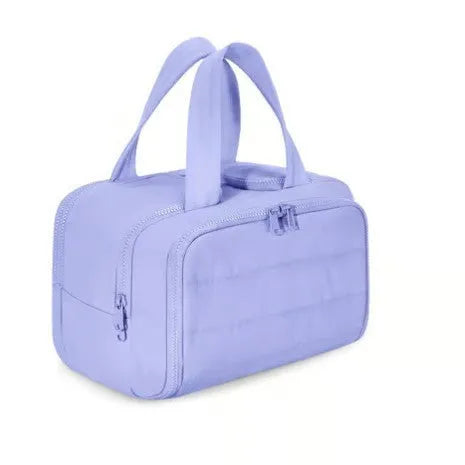 Large travel toiletry bag with wide open top showing interior capacity