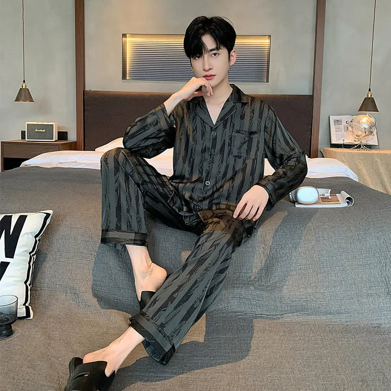 Men's black striped ice silk V-neck pyjama set with long sleeves and trousers.