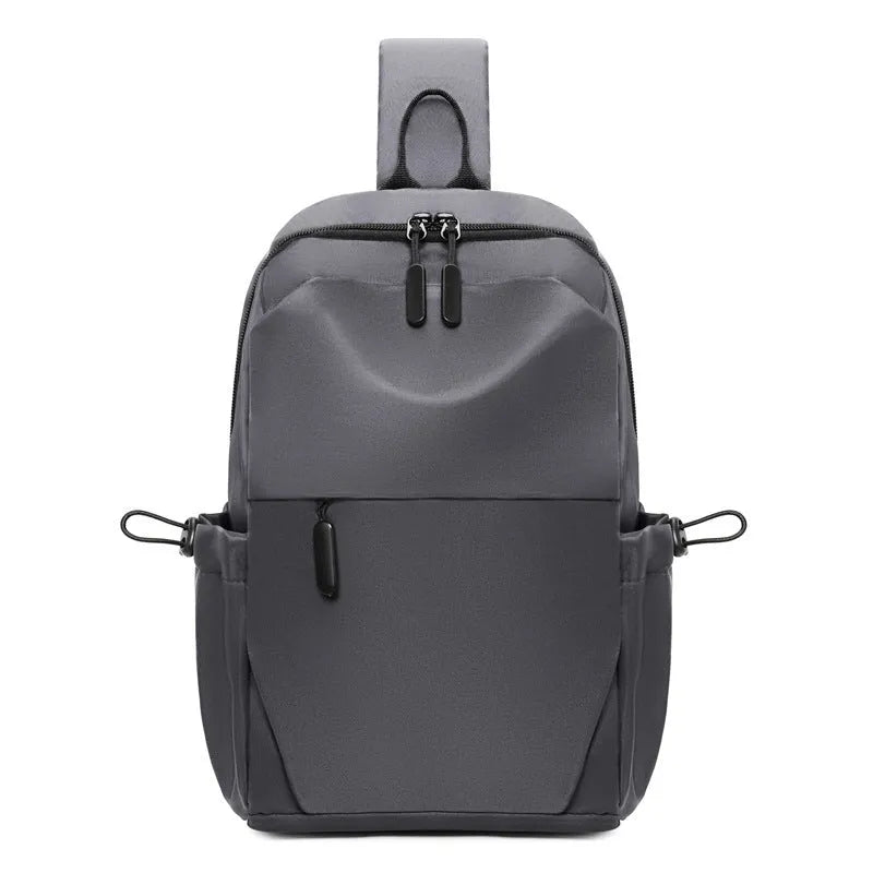 Grey mens chest bag showing shoulder strap and main compartment with waterproof exterior.