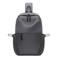 Grey mens chest bag showing shoulder strap and main compartment with waterproof exterior.