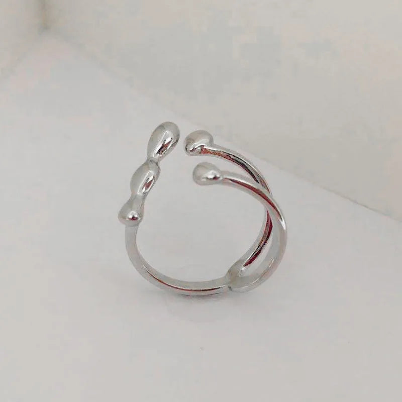 Brass opening ring with spherical design in gold or silver colour for women