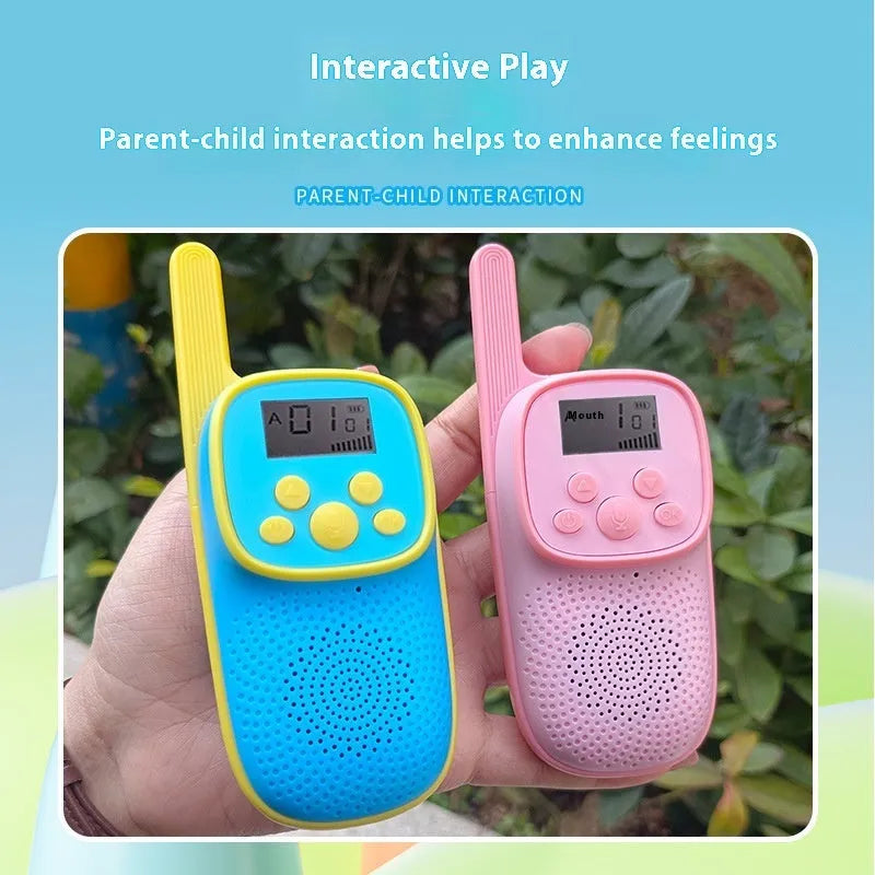 Wireless cartoon children's walkie-talkie toy pair in pink and blue with non-slip grip, hanging ropes, and packaging box
