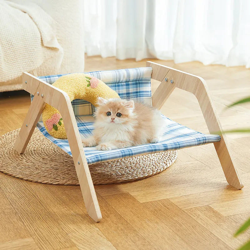 Wooden frame cat hammock bed with blue cloth in beach chair design for indoor cats.