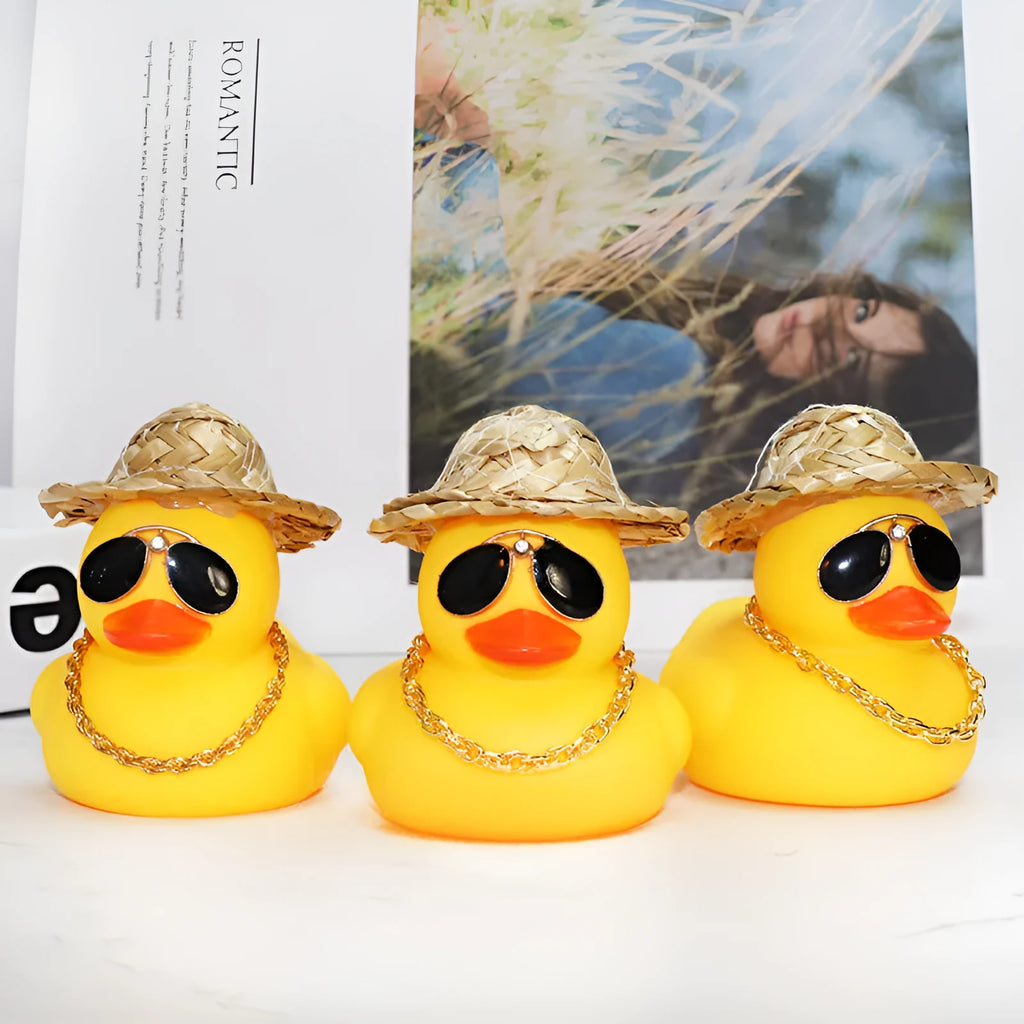 Yellow cartoon duck car ornament with straw hat and metal sunglasses for dashboard decoration