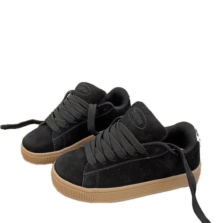 Black retro low-top sneakers with round toe, front lace-up, and waterproof platform sole