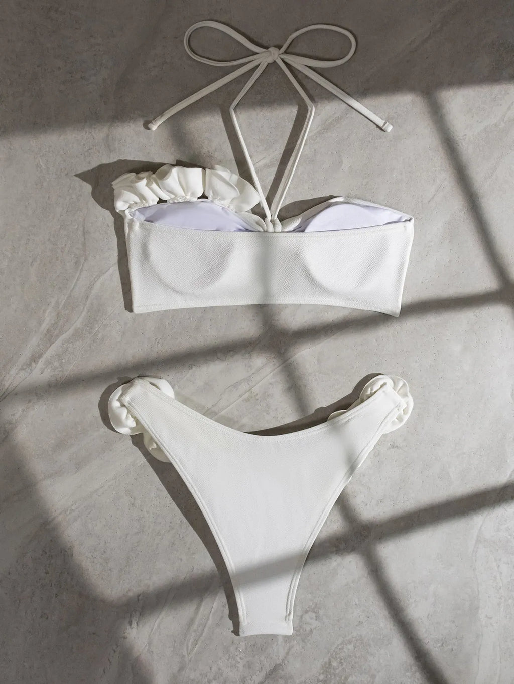 White split swimsuit with three-dimensional flower, halter lace-up neck, and briefs style, sizes S M L