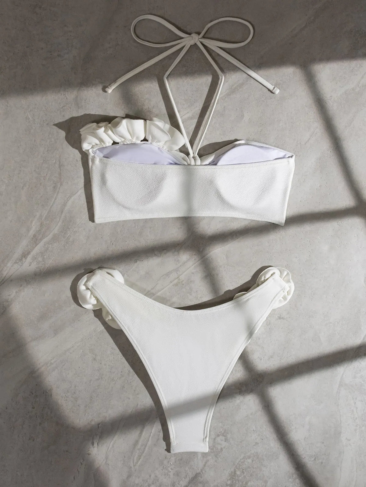 White split swimsuit with three-dimensional flower, halter lace-up neck, and briefs style, sizes S M L