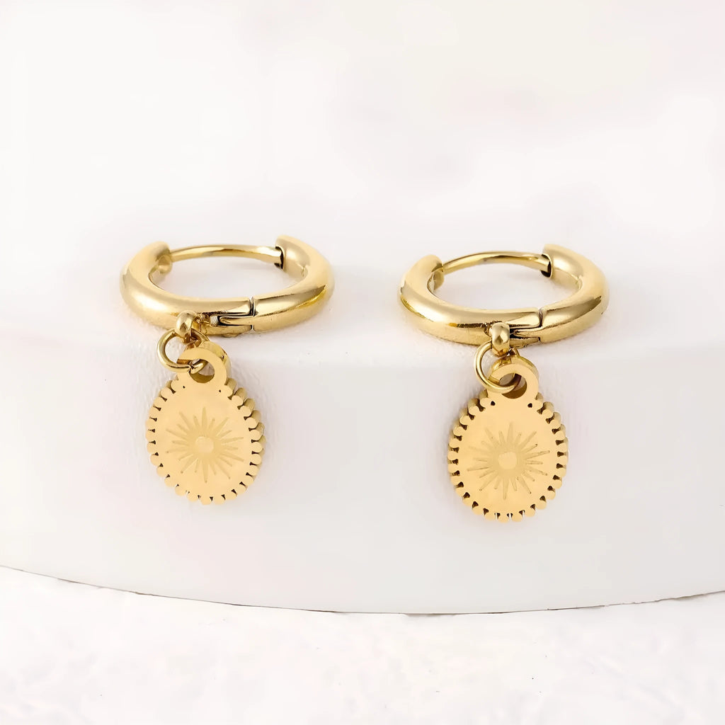 Silver geometric ellipse stud earrings for women made from stainless steel.